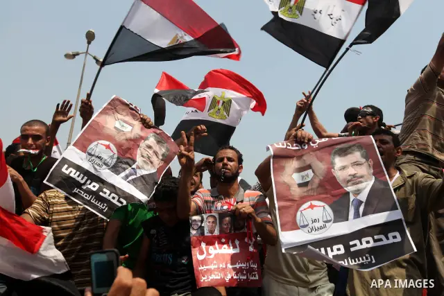 Supporters of Egypt's Muslim Brotherhood candidate Mohammed Morsi celebrate in Tahrir square after the Brotherhood claimed win in presidential vote, in Cairo, Egypt, 18 June 2012. Hundreds of Muslim Brotherhood supporter...