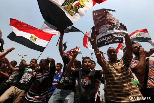 Supporters of Egypt's Muslim Brotherhood candidate Mohammed Morsi celebrate in Tahrir square after the Brotherhood claimed win in presidential vote, in Cairo, Egypt, 18 June 2012. Hundreds of Muslim Brotherhood supporter...