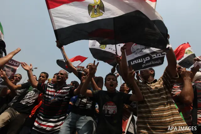 Supporters of Egypt's Muslim Brotherhood candidate Mohammed Morsi celebrate in Tahrir square after the Brotherhood claimed win in presidential vote, in Cairo, Egypt, 18 June 2012. Hundreds of Muslim Brotherhood supporter...