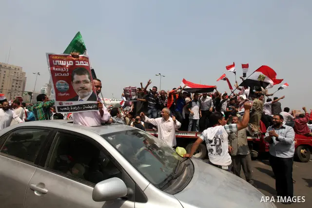 Supporters of Egypt's Muslim Brotherhood candidate Mohammed Morsi celebrate in Tahrir square after the Brotherhood claimed win in presidential vote, in Cairo, Egypt, 18 June 2012. Hundreds of Muslim Brotherhood supporter...