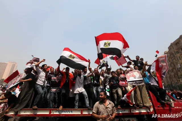 Supporters of Egypt's Muslim Brotherhood candidate Mohammed Morsi celebrate in Tahrir square after the Brotherhood claimed win in presidential vote, in Cairo, Egypt, 18 June 2012. Hundreds of Muslim Brotherhood supporter...