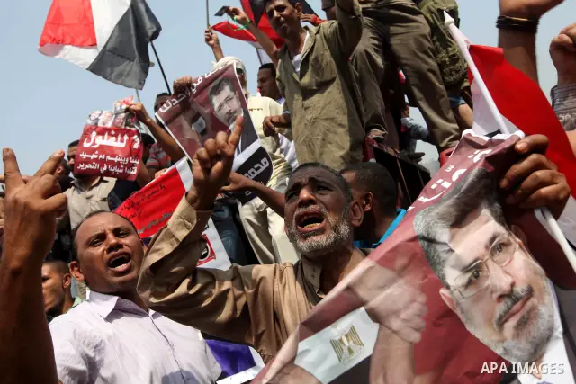 Supporters of Egypt's Muslim Brotherhood candidate Mohammed Morsi celebrate in Tahrir square after the Brotherhood claimed win in presidential vote, in Cairo, Egypt, 18 June 2012. Hundreds of Muslim Brotherhood supporter...