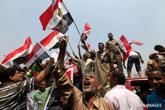 Supporters of Egypt's Muslim Brotherhood candidate Mohammed Morsi celebrate in Tahrir square after the Brotherhood claimed win in presidential vote, in Cairo, Egypt, 18 June 2012. Hundreds of Muslim Brotherhood supporter...