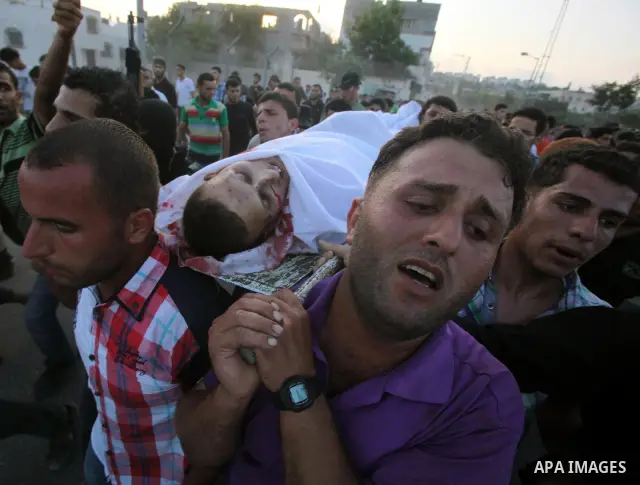 Palestinians carry the body of Abd El-Kareem Al-Za'aneen during his funeral after he was killed in an Israeli air strike near Beit Hanoun, northern Gaza Strip, Monday, June 18, 2012. The Israeli strike comes after killed...