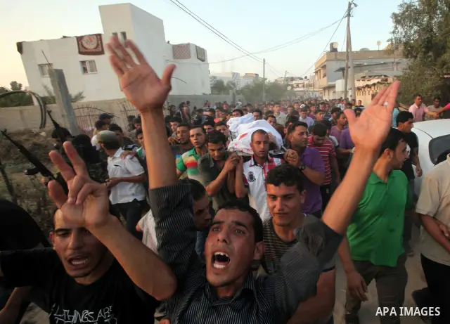 Palestinians carry the body of Abd El-Kareem Al-Za'aneen during his funeral after he was killed in an Israeli air strike near Beit Hanoun, northern Gaza Strip, Monday, June 18, 2012. The Israeli strike comes after killed...