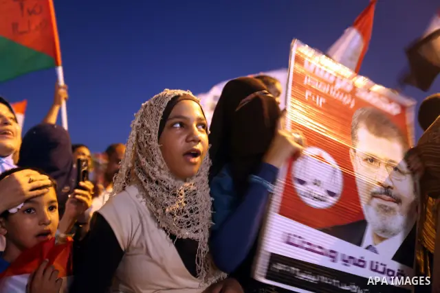 Supporters of Egypt's Muslim Brotherhood presidential candidate Mohammed Morsi celebrate after the Brotherhood claimed win in presidential vote, in Tahrir square, Cairo, Egypt, 18 June 2012. Hundreds of Muslim Brotherhoo...