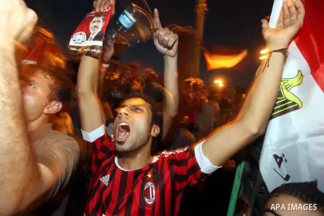 Supporters of Egypt's Muslim Brotherhood presidential candidate Mohammed Morsi celebrate after the Brotherhood claimed win in presidential vote, in Tahrir square, Cairo, Egypt, 18 June 2012. Hundreds of Muslim Brotherhoo...