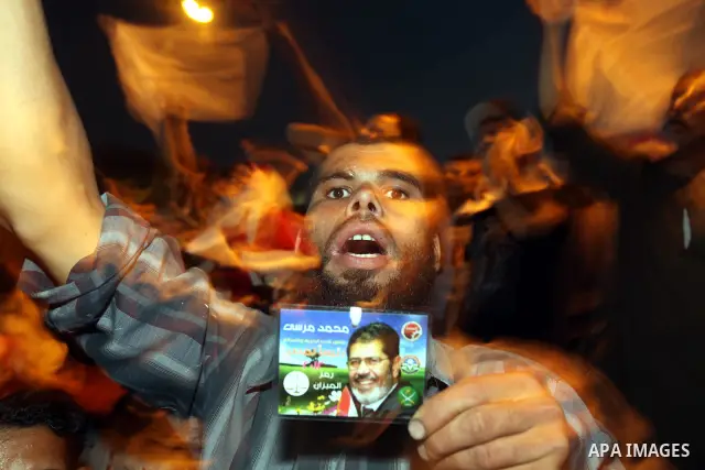 Supporters of Egypt's Muslim Brotherhood presidential candidate Mohammed Morsi celebrate after the Brotherhood claimed win in presidential vote, in Tahrir square, Cairo, Egypt, 18 June 2012. Hundreds of Muslim Brotherhoo...