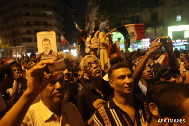 Supporters of Egypt's Muslim Brotherhood presidential candidate Mohammed Morsi celebrate after the Brotherhood claimed win in presidential vote, in Tahrir square, Cairo, Egypt, 18 June 2012. Hundreds of Muslim Brotherhoo...