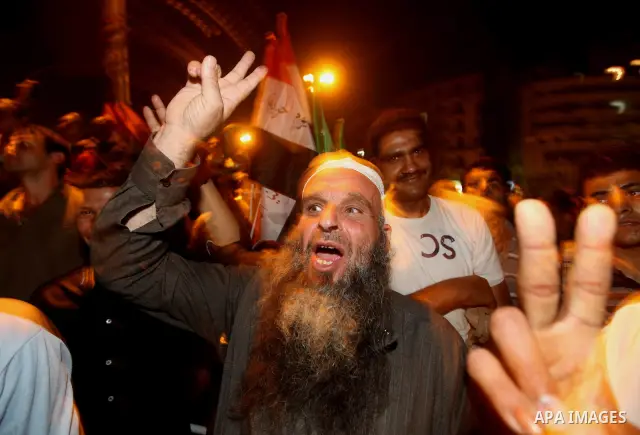 Supporters of Egypt's Muslim Brotherhood presidential candidate Mohammed Morsi celebrate after the Brotherhood claimed win in presidential vote, in Tahrir square, Cairo, Egypt, 18 June 2012. Hundreds of Muslim Brotherhoo...