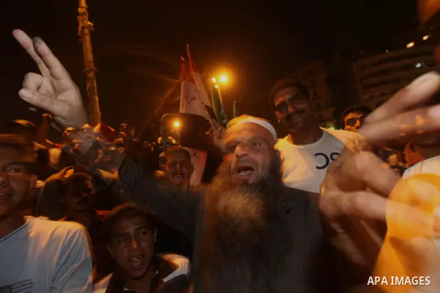Supporters of Egypt's Muslim Brotherhood presidential candidate Mohammed Morsi celebrate after the Brotherhood claimed win in presidential vote, in Tahrir square, Cairo, Egypt, 18 June 2012. Hundreds of Muslim Brotherhoo...