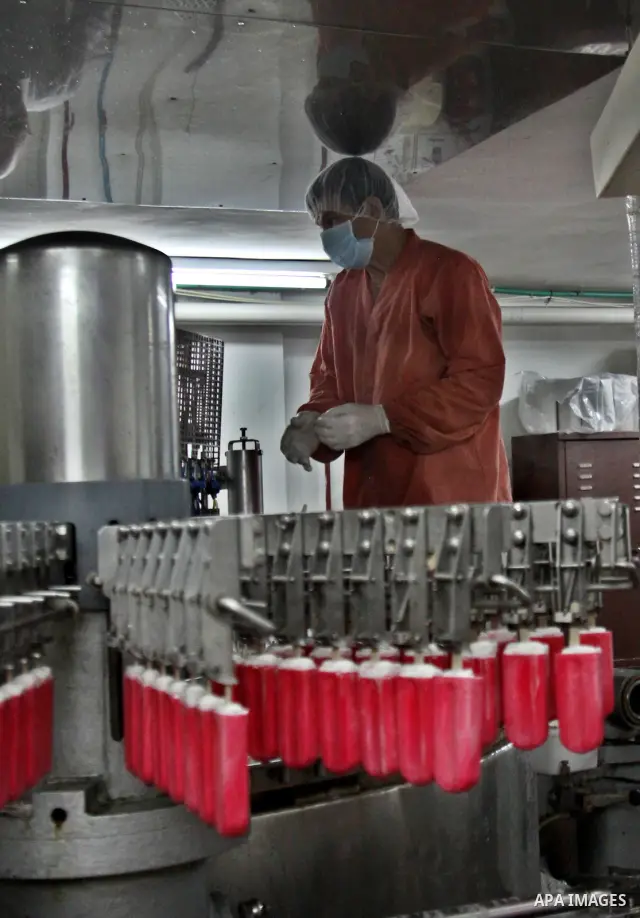 A Palestinian employee works at the Al-Arz ice cream factory in the West Bank City of Nablus on June 19, 2012. Photo by Nedal Eshtayah