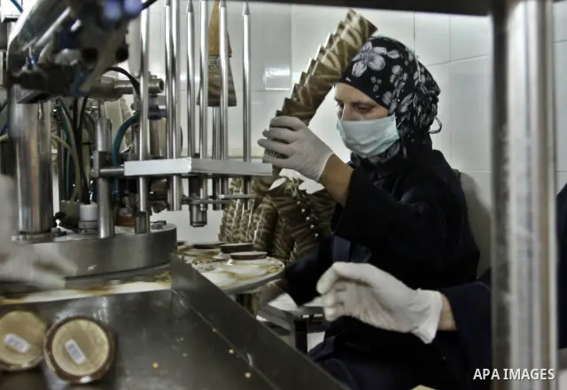 Palestinian women made pack ice cream cones at the Al-Arz ice cream factory in the West Bank City of Nablus on June 19, 2012. Photo by Nedal Eshtayah