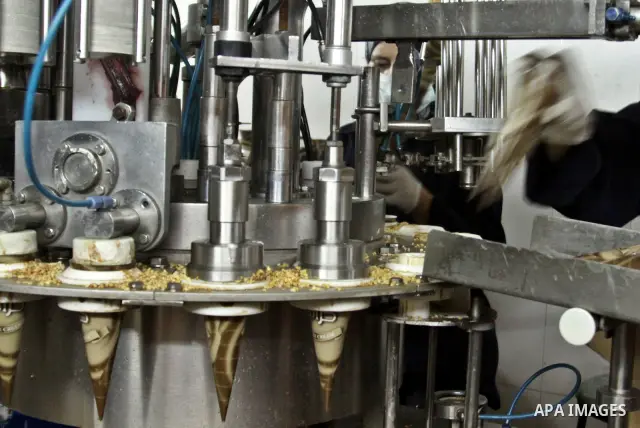 Palestinian women made pack ice cream cones at the Al-Arz ice cream factory in the West Bank City of Nablus on June 19, 2012. Photo by Nedal Eshtayah