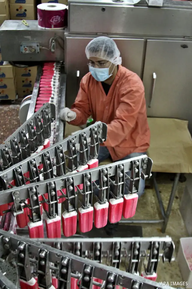 A Palestinian employee works at the Al-Arz ice cream factory in the West Bank City of Nablus on June 19, 2012. Photo by Nedal Eshtayah