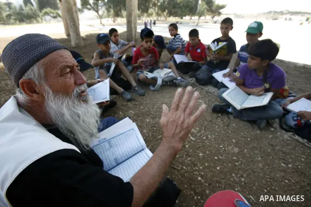 Palestinian children participate in summer camps at Al-Aqsa mosque in the old city of Jerusalem on 19 June 2012. Photo by Mahfouz Abu Turk