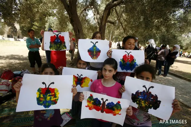 Palestinian children participate in summer camps at Al-Aqsa mosque in the old city of Jerusalem on 19 June 2012. Photo by Mahfouz Abu Turk