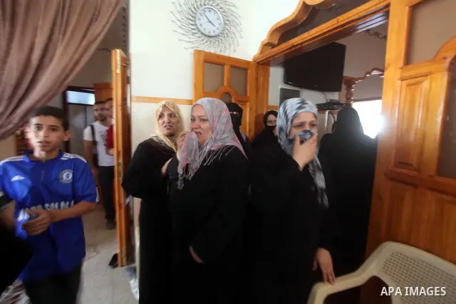 Relatives of Palestinian Mohammed abu Maleg mourn during his funeral in Al-Maghazi refugee camp in the central Gaza Strip June 19, 2012. An Israeli air strike killed two Palestinians, one of them abu Maleg, in the Gaza S...