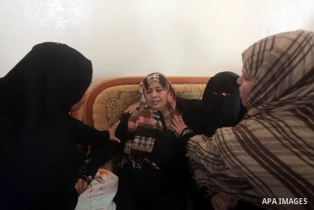 Relatives of Palestinian Mohammed abu Maleg mourn during his funeral in Al-Maghazi refugee camp in the central Gaza Strip June 19, 2012. An Israeli air strike killed two Palestinians, one of them abu Maleg, in the Gaza S...