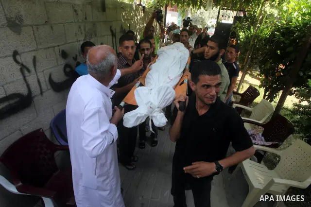 Relatives of Palestinian Mohammed abu Maleg mourn during his funeral in Al-Maghazi refugee camp in the central Gaza Strip June 19, 2012. An Israeli air strike killed two Palestinians, one of them abu Maleg, in the Gaza S...