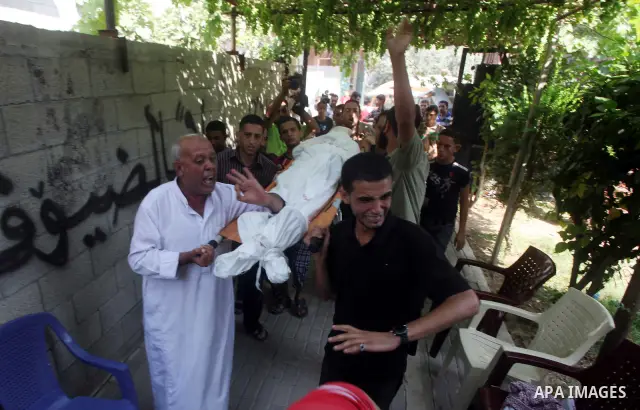 Relatives of Palestinian Mohammed abu Maleg mourn during his funeral in Al-Maghazi refugee camp in the central Gaza Strip June 19, 2012. An Israeli air strike killed two Palestinians, one of them abu Maleg, in the Gaza S...