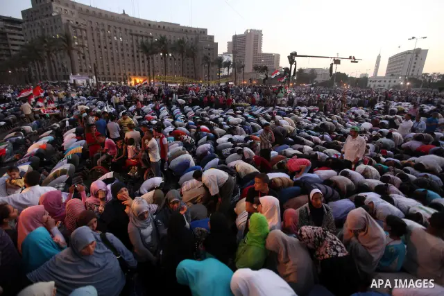 Egyptian Muslim Brotherhood supporters attend prayers during an anti ruling military council demonstration in Tahrir Square, Cairo, Egypt Tuesday, June 19, 2012. A campaign spokesman for Hosni Mubarak's ex-prime minister...