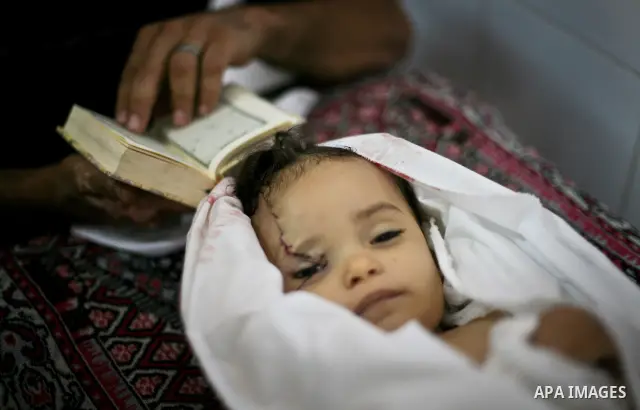 Palestinian mourners pray over the body of Hadeel al-Hadad during her funeral in Gaza City on 20 June 2012. Hadeel was killed June 19 when Palestinian militants launched a rocket from Gaza City, which failed to reach its...