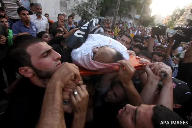 Palestinian mourners carry the body of militant Basil Ahmad during his funeral in Bureij refugee camp, central Gaza Strip, Friday, June 22, 2012. Palestinian sources say that Ahmad was killed during an Israeli airstrike...