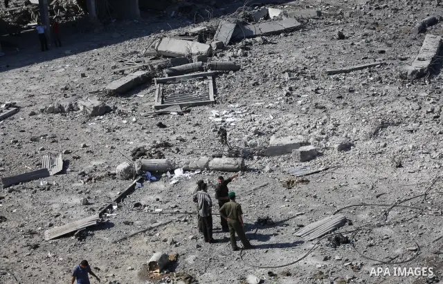 Palestinian Hamas security personnel inspect the damage at al-Saraya Security complex in the centre of Gaza City on June 23, 2012 as Israel launched fresh air strikes on the Gaza Strip overnight after killing two people...