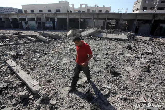 Palestinian Hamas security personnel inspect the damage at al-Saraya Security complex in the centre of Gaza City on June 23, 2012 as Israel launched fresh air strikes on the Gaza Strip overnight after killing two people...