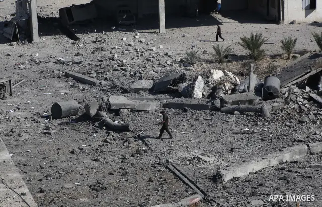 Palestinian Hamas security personnel inspect the damage at al-Saraya Security complex in the centre of Gaza City on June 23, 2012 as Israel launched fresh air strikes on the Gaza Strip overnight after killing two people...