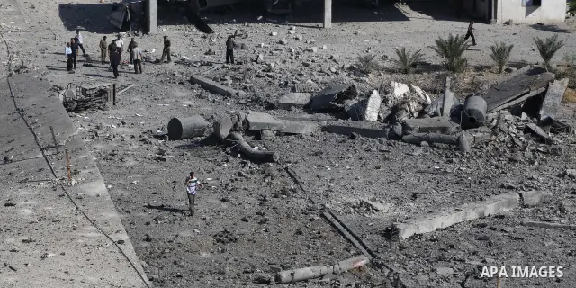 Palestinian Hamas security personnel inspect the damage at al-Saraya Security complex in the centre of Gaza City on June 23, 2012 as Israel launched fresh air strikes on the Gaza Strip overnight after killing two people...