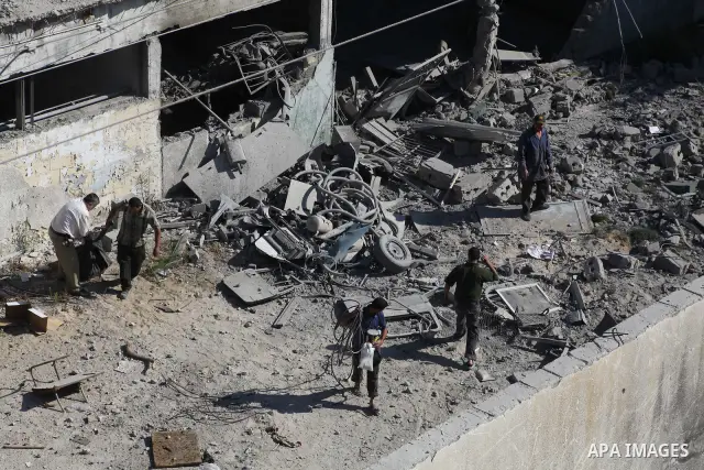 Palestinian Hamas security personnel inspect the damage at al-Saraya Security complex in the centre of Gaza City on June 23, 2012 as Israel launched fresh air strikes on the Gaza Strip overnight after killing two people...