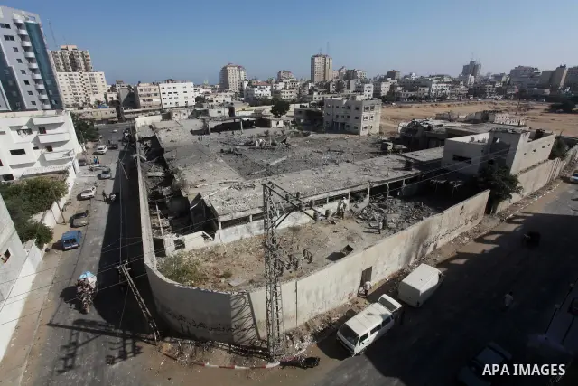 Palestinian Hamas security personnel inspect the damage at al-Saraya Security complex in the centre of Gaza City on June 23, 2012 as Israel launched fresh air strikes on the Gaza Strip overnight after killing two people...
