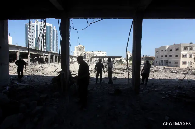 Palestinian Hamas security personnel inspect the damage at al-Saraya Security complex in the centre of Gaza City on June 23, 2012 as Israel launched fresh air strikes on the Gaza Strip overnight after killing two people...