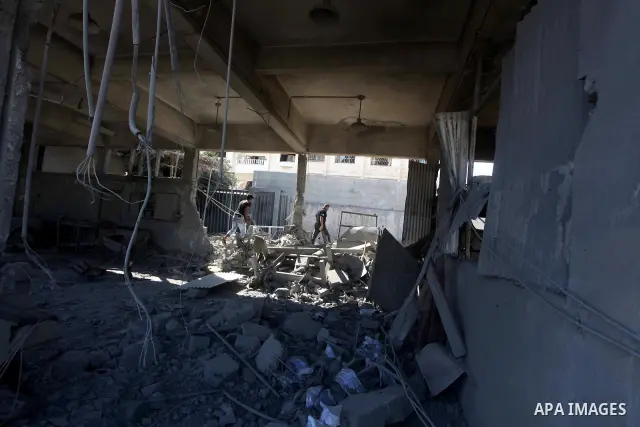 Palestinian Hamas security personnel inspect the damage at al-Saraya Security complex in the centre of Gaza City on June 23, 2012 as Israel launched fresh air strikes on the Gaza Strip overnight after killing two people...