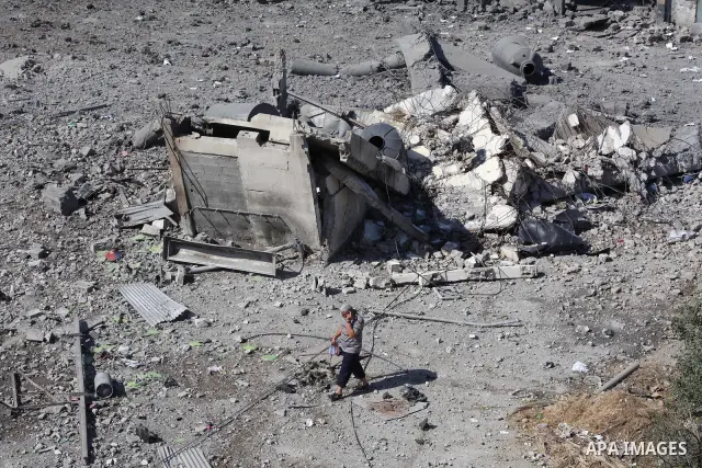 Palestinian Hamas security personnel inspect the damage at al-Saraya Security complex in the centre of Gaza City on June 23, 2012 as Israel launched fresh air strikes on the Gaza Strip overnight after killing two people...