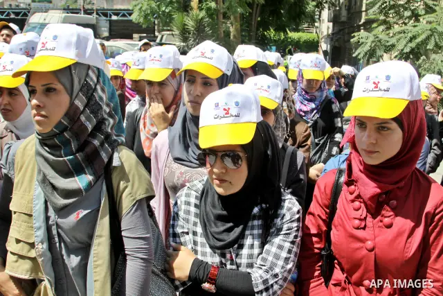 Palestinians wearing hats with the slogan " no for drugs" march in the streets of the West Bank city of Nablus on June 23, 2012 as part of an awareness campaign, entitled "fighting drug", against the consumption of narco...