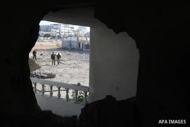 A Palestinian Hamas security personnel inspects the damage at al-Saraya Security complex in the centre of Gaza City on June 23, 2012 as Israel launched fresh air strikes on the Gaza Strip overnight after killing two peop...