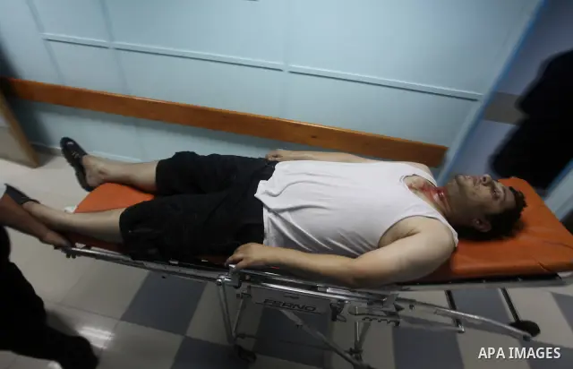 A Palestinian medic wheels a wounded man at a hospital in Gaza City, following an Israeli air strike June 23, 2012. Israeli air strikes on Hamas security targets in Gaza killed two Palestinians and wounded 30 people on S...