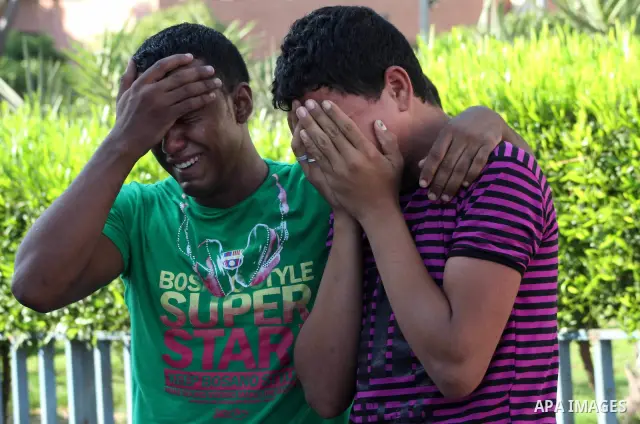 Palestinian relatives of Osama Ali grieves at the morgue after the teenager was killed in an Israeli strike on Gaza City on June 23, 2012. The Palestinian teenager riding a motorcycle was killed, and 10 passers-by wounde...