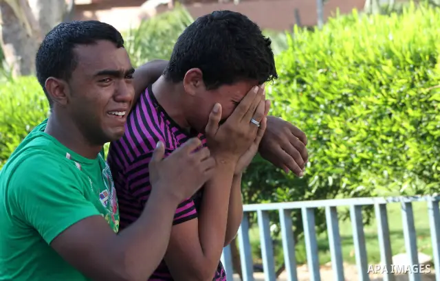 Palestinian relatives of Osama Ali grieves at the morgue after the teenager was killed in an Israeli strike on Gaza City on June 23, 2012. The Palestinian teenager riding a motorcycle was killed, and 10 passers-by wounde...