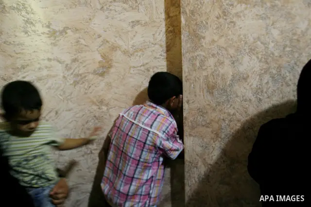 Palestinian relatives mourn during the funeral procession of six-year-old Ali al-Shwaf in Khan Younis, in the southern Gaza Strip on June 23, 2012, after he was killed during an Israeli air strike in Gaza and his father...