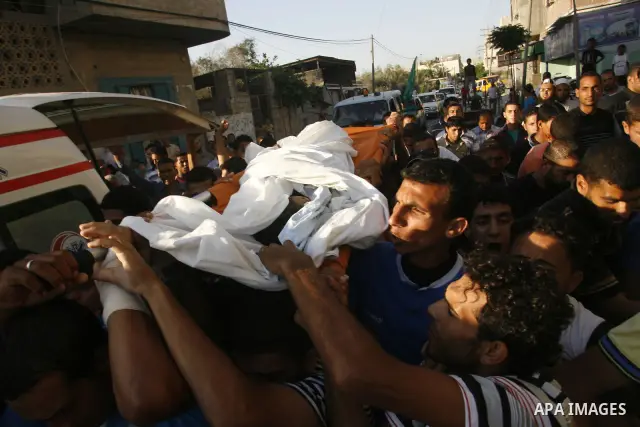 Palestinian mourners carry the body of 6-year-old Ali al-Shwaf during his funeral in Khan Younis, southern Gaza Strip, Saturday, June 23, 2012. Gaza's militant Hamas rulers threatened to escalate fighting with Israel on...