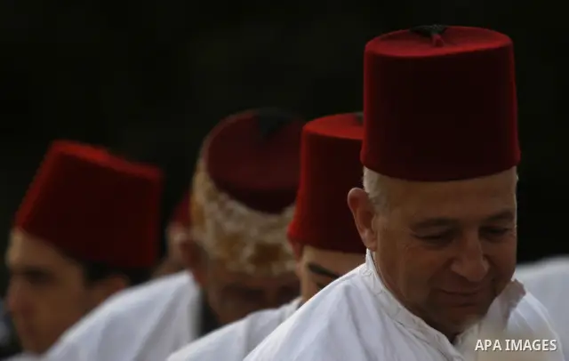 Samaritans attend Shavuot festival on Mount Gerizim near the northern West Bank city of Nablus on June 24, 2012 which is giving of the Torah at Mount Sinai seven weeks after the exodus of the Jewish people from Egypt. Th...