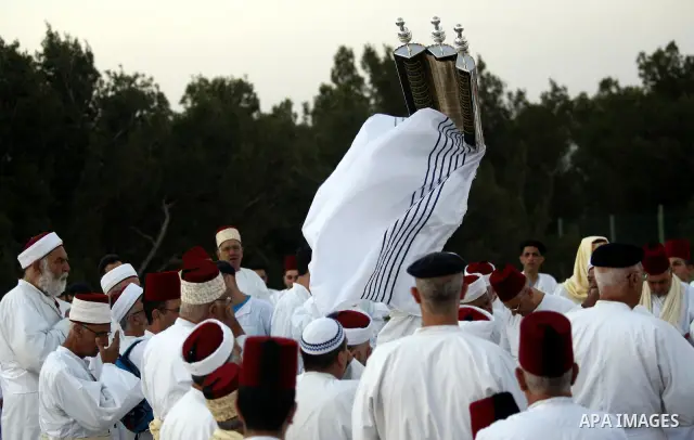 Samaritans attend Shavuot festival on Mount Gerizim near the northern West Bank city of Nablus on June 24, 2012 which is giving of the Torah at Mount Sinai seven weeks after the exodus of the Jewish people from Egypt. Th...