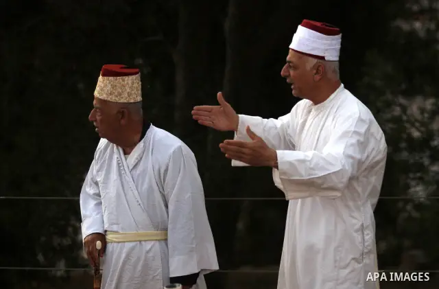 Samaritans attend Shavuot festival on Mount Gerizim near the northern West Bank city of Nablus on June 24, 2012 which is giving of the Torah at Mount Sinai seven weeks after the exodus of the Jewish people from Egypt. Th...