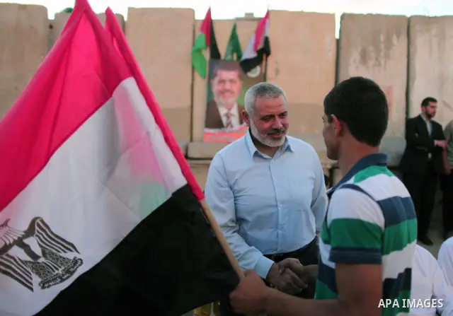 Hamas Prime Minister Sheikh Ismael Haneiya celebrates with Palestinian people, in Gaza City, Gaza, 24 June 2012, after the Egyptian Presidential election committee announced Mohamed Morsi as victor. The Muslim Brotherhoo...
