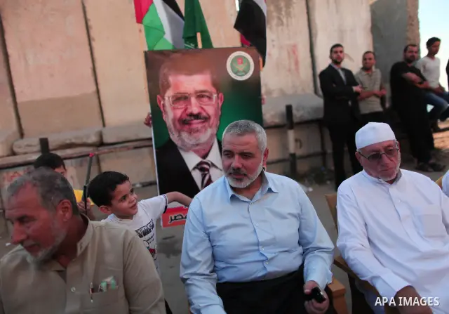 Hamas Prime Minister Sheikh Ismael Haneiya celebrates with Palestinian people, in Gaza City, Gaza, 24 June 2012, after the Egyptian Presidential election committee announced Mohamed Morsi as victor. The Muslim Brotherhoo...