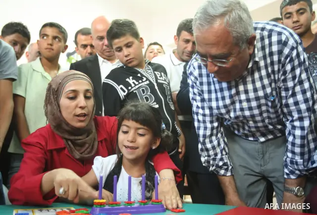 Palestinian Prime Minister, Salam Fayyad attends the opening of the center of Yatta Municipality, in the West Bank of Hebron on June 24, 2012. Photo by Mahmoud Hrebat